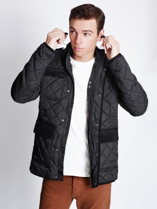 A jacket with built in headphones, speakers and control system